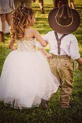 
                        
                            Little cowboy ringer bearer and his princess flower girl. Rustic Country Wedding. OMG would love this to bet little bro and sis
                        
                    