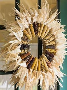 
                    
                        Great Wow factor here with just a couple of supplies..... a straw wreath form and lots of Indian corn. This would be beautiful displayed over a mantel as well as on the front door
                    
                
