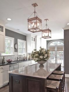 
                    
                        White cabinets, grey walls, neutral backslash, dark island--design by Carolina Design Associates. www.remodelworks.com
                    
                