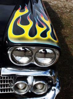 
                    
                        Cool flames on a hot rod 1950s Chevy
                    
                