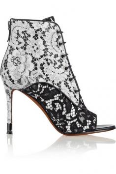 
                        
                            Lace on black and white leather ankle boots
                        
                    