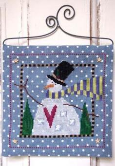 
                    
                        Snow Magical is the title of this cross stitch kit that includes the pattern, wire hanger and button pack. You supply the threads (Weeks Dye Works Daffodil, Daylily, Envy, Oak, Onyx, Peoria Purple, Romance, Swiss Chocolate and Whitewash) or DMC threads.
                    
                