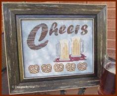 
                    
                        Cheers is the title of this cross stitch pattern from Designs by Lisa that is stitched with Gentle Art Sampler threads (Brandy, Pebble, Banker's Grey, Oatmeail, Fisherman's Wharf/2, Straw Bonnet, Weathered Barn, Picnic Basket and Baked Clay).
                    
                
