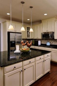 Would love to have a kitchen with an island and black marble counter tops! :)