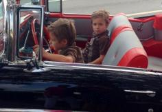 
                    
                        Hot rod convertible with twins driving red interior adorable kid photo car show pinup mommy little greasers 1950s
                    
                