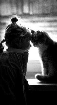 
                    
                        Black and White photo of little girl and cat
                    
                