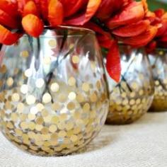 
                        
                            Make these simple but chic gold dot vases. They look great with fall flowers and are versatile enough for any time of year.
                        
                    