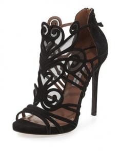 
                    
                        curvaceous straps of this Tabitha Simmons statement sandal.
                    
                