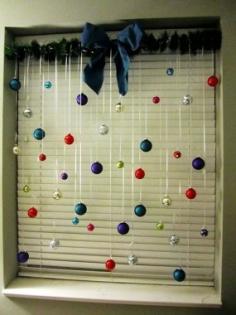 
                        
                            Decorate your windows for Christmas by hanging ornaments.
                        
                    