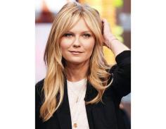 @Margaret Byrd Beauty - Kirsten Dunst’s center-parted long bangs seamlessly blend with her layers.