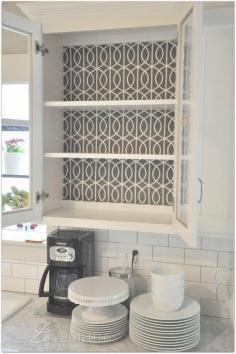 
                    
                        Use fabric for the backing of shelves instead of paint or wallpaper. Love this idea for glass front cabinets. Smart!
                    
                