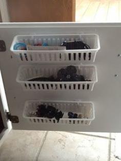 
                    
                        add small baskets on the inside of cabinet doors to hold those small items like hair supplies, makeup, etc...
                    
                