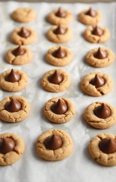 
                    
                        Peanut Butter Blossoms combine a simple peanut butter cookie with a chocolate kiss plopped right in the middle for an especially delicious sweet bite.
                    
                