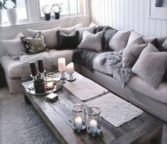 cozy living room - wooden coffee table, big comfy couch and fluffy pillows