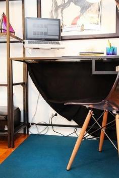 
                    
                        Hang a black dropcloth behind your desk to hide a tangled mass of wires. | 36 Genius Ways To Hide The Eyesores In Your Home
                    
                