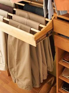 
                    
                        Every closet should have one of these! A wooden pullout trouser rack. This rack holds 10 pairs of pants and the dowels lift out! How "neat" is that!?
                    
                