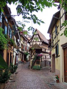 On the streets of Eguisheim (Alsace), one of the most beautiful villages in France -what a beautiful place.  I would love to be standing there right now!