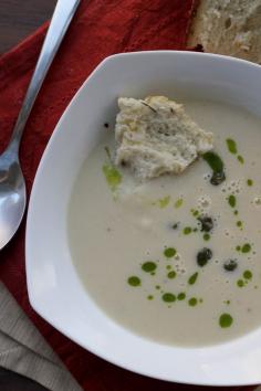 
                    
                        Creamy cauliflower soup gets all dressed up with chive oil and fried capers, with a warm loaf of spicy garlic bread to dunk in it!
                    
                