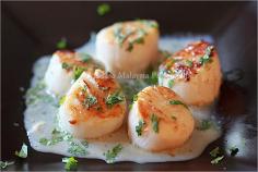 
                    
                        Seared Scallops Recipe with a cream sauce infused with Tahitian vanilla and whiskey.
                    
                