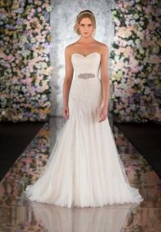 
                    
                        This modified fit-and-flair vintage lace wedding dress from the Martina Liana collection features heirloom quality Chantilly Lace and Tulle that transforms seamlessly into a flowing Silk Chiffon skirt. A back zipper hidden under lace buttons adds timeless appeal, and delicate details give this vintage lace wedding dress a romantic flair.  Make this designer gown your own with the chic, hand-beaded crystal Tori sash in natural, topaz, bisque, blossom or orchid.  Fabric Color Choices Martina ...
                    
                