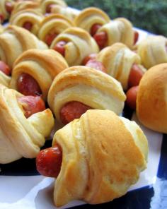 
                    
                        Pigs in a Blanket - Football Friday | Plain Chicken -pinning as a reminder to use a pizza cutter to cut the crescent rolls longways before rolling around sausage
                    
                