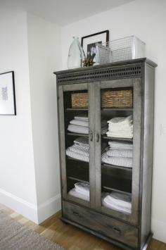 Linen cabinet from a modern farmhouse by h2 Design + Build