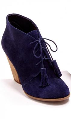 
                    
                        Soft suede lace up bootie with tassel detail on laces, rounded toe and a stacked heel.
                    
                
