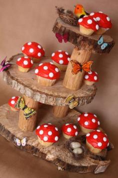 Wood slice fairy cake stand and adorable toadstool cupcakes. Would work for Minnie Mouse too