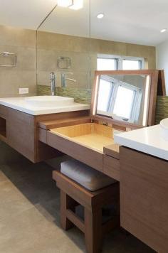 Vanity table that lifts up to reveal lighted mirror.  Keeps make up & toiletries hidden away when not in use.  Also has outlet in back that will be hidden when vanity lid is closed.  Noe Valley Master Suite in San Francisco, California designed by W. David Seidel, AIA - Architect