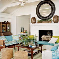 
                    
                        Notice wooden sofa with loose cushion.  Treated like a bench. Trick of the Trade - Casual Chic Lake House - Southern Living
                    
                