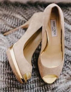 Gold Jimmy Choo shoes. With high heels and slight platform. Love these i know they are wedding shoes but id wear these anyday