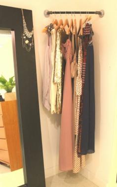 Do this is laundry room! next little project. Good idea! Corner rod for planning outfits/what to wear the next day. Super duper clever for those wasteful corner spaces! You could put a corner shelf above and plan your shoes and jewelry too!!