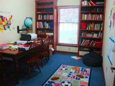 Homeschool room:  I like the bookcases flanking the window.