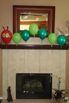 Birthday party theme with Hungry Caterpillar balloons.