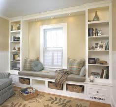Window seat and built in shelving system. Good idea for master bedroom.