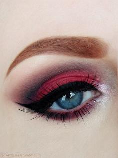 Red eyeshadow and winged eyeliner.