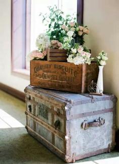 French decor-  loving the old trunks and fresh flowers.
