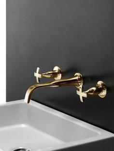 gold fixtures on black wall