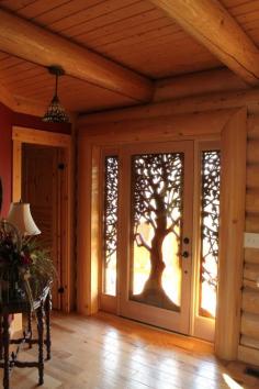 
                    
                        Incredible hand carved wooden tree front door
                    
                