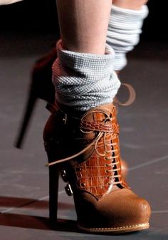 
                    
                        Fashion trend 2015. Attractive chocolate high heeled boots.
                    
                