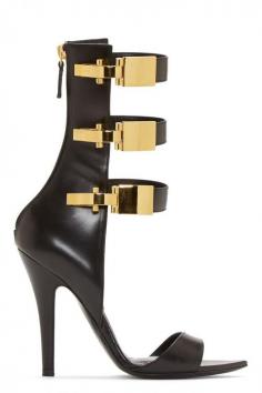 Calf-hight buffed leather sandals in black. Pointed-toe. Gold-tone hardware. Decorative claps at straps. Zip-closure at heel counter. Approx. 4" heel. Part of the Versus Anthony Vaccarello collaboration. 995$