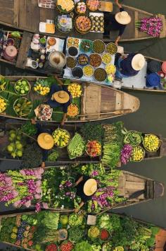 A floating market in Thailand. This is beautiful. I would absolutely love to visit this breathtaking place.