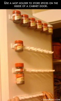 Forget the spice rack!!  Use a mop holder to store spices on the inside of a cabinet door. (no more searching through the deep cupboard for that one spice!) Been looking for a spice storage solution for ages. How simple. Just have to find the mop holder now...