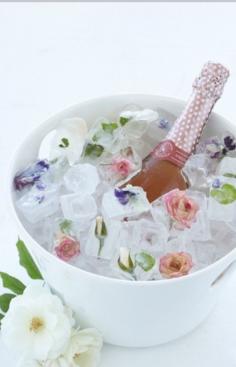 Roses frozen in ice blocks to keep the champagne cold (and looking pretty!)  - lovely idea for a wedding, bridal shower or for an extra special date night or anniversary xo