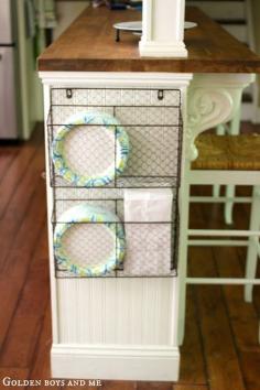 Kitchen Island {Ikea Hack}... Great idea for having paper plates available, off of counter space and out of the way.. (Home Goods wire basket)