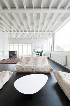 Love the dark floors with white walls & ceiling.