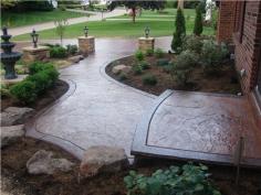 
                    
                        Beautifully stamped concrete entryway and driveway blend perfectly with surrounding landscape. J Decorative Concrete Uniontown, OH
                    
                