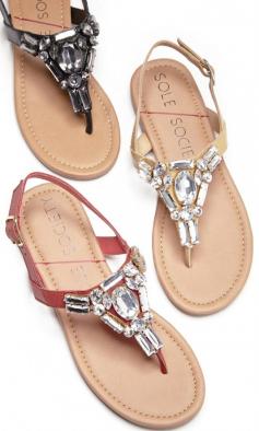 
                    
                        Flat sandals bejeweled in sparkling crystal stones along the t-straps. ==
                    
                