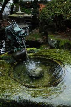 find a dragon fountain - A pool among the rock, gardens of Himeji Castle, Japan (by Mark Liddell).