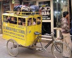 
                    
                        Tricycle school bus. India.
                    
                